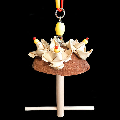 An adorable swing built for two! Made with a coconut shell and crunchy palm leaf rosettes with a 3/8