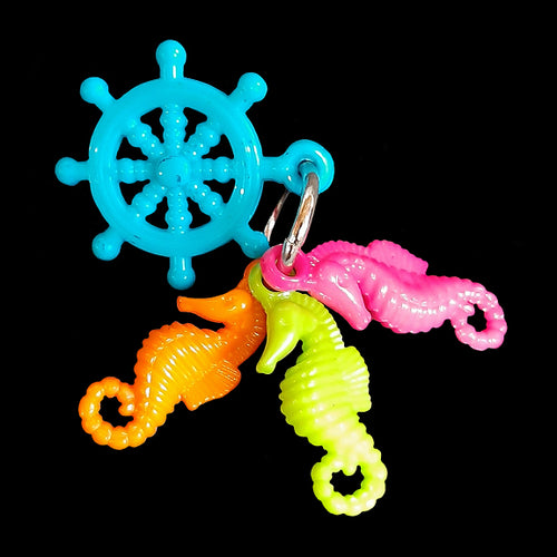 Designed for little beaks and feet! A light-weight foot toy made with acrylic seahorse charms attached to a ship's helm charm. Designed for small parrots such as green cheek conures, cockatiels or other birds that like to fiddle with foot toys.