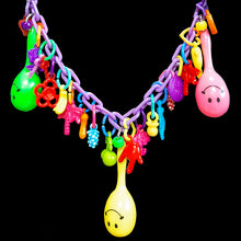Load image into Gallery viewer, Does your bird love to play with your zipper, buttons or jewelry? If so, both of you will love this necklace made just for them! Designed to be worn around your neck so your bird can play while on you. Made with plastic chain, lots of charms and three mini maracas, this bird-safe necklace is sure to be a hit for birds and bird parents alike! Available in different color combinations (no two will be alike).
