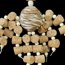 Load image into Gallery viewer, Two dozen corks with little wood snap beads dangling from a sola rope ball center with natural wood beads and shapes. Designed for small to intermediate sized birds.
