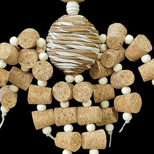 Two dozen corks with little wood snap beads dangling from a sola rope ball center with natural wood beads and shapes. Designed for small to intermediate sized birds.