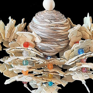 Eight strands of hemp cord filled with crunchy palm leaf shredders and crystal beads on a sola rope ball center. Designed for small to intermediate sized birds.