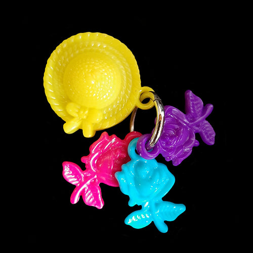 Designed for little beaks and feet! A light-weight foot toy made with acrylic flower charms attached to a sun bonnet charm. Designed for small parrots such as green cheek conures, cockatiels or other birds that like to fiddle with foot toys. Comes in assorted color combinations.